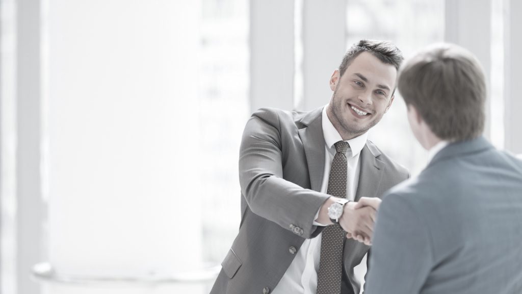 Two people greeting each other