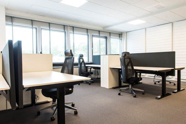 A office room with tables and chairs