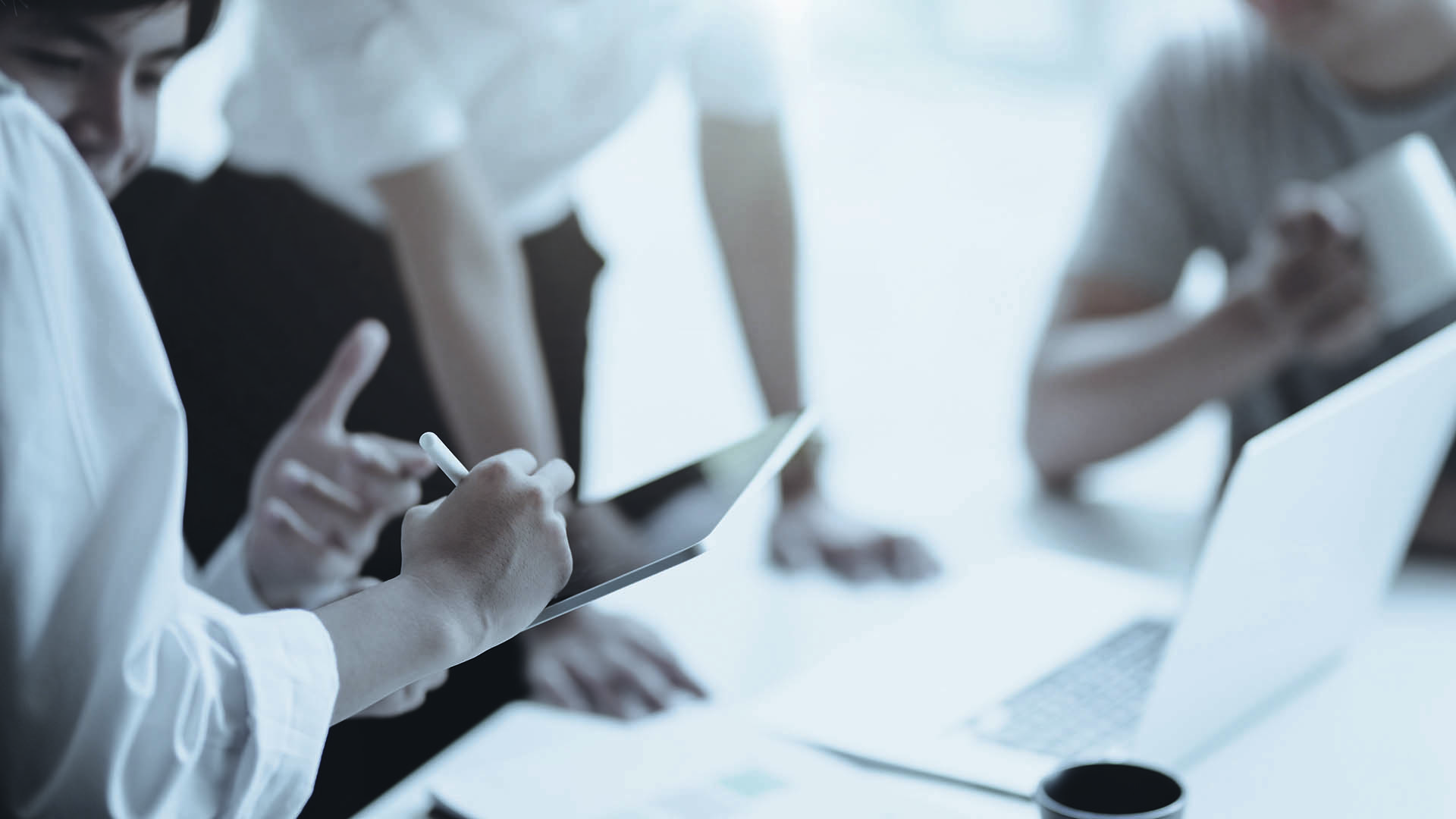 Out of focus image of people in a meeting
